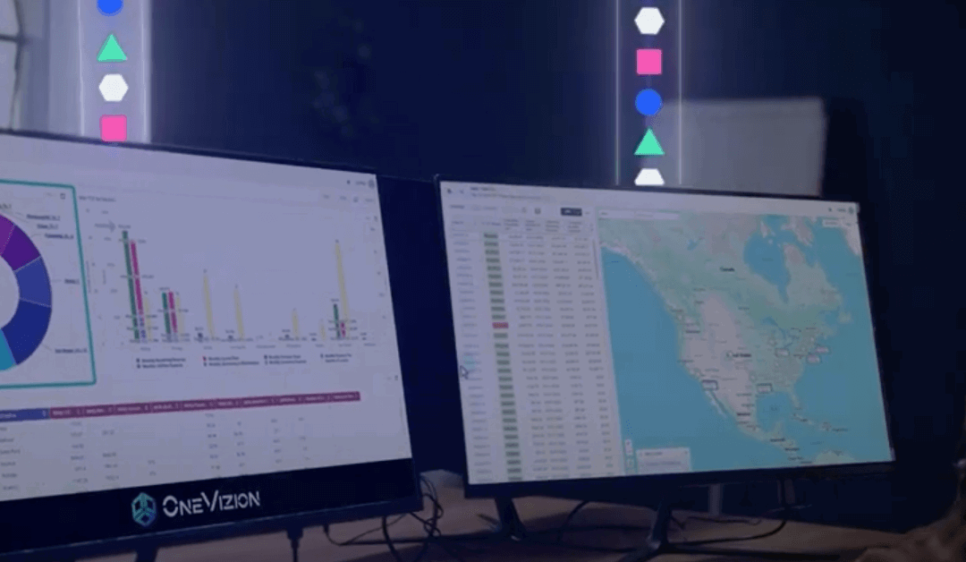 Two computer monitors display data: the left shows charts and graphs, while the right displays a spreadsheet and a map of North America.
